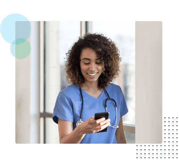 Smiling nurse looking at phone - HealthStream