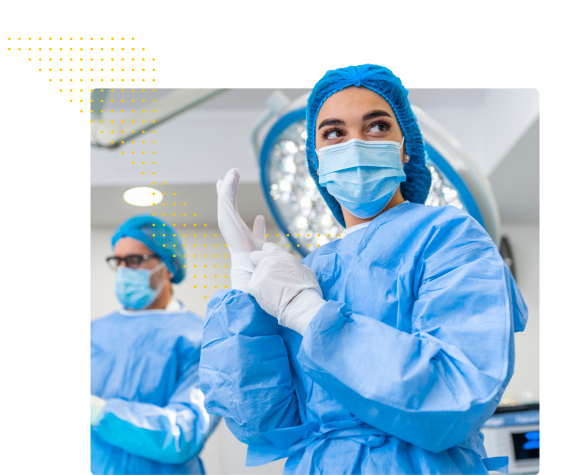 Surgical tech putting gloves on